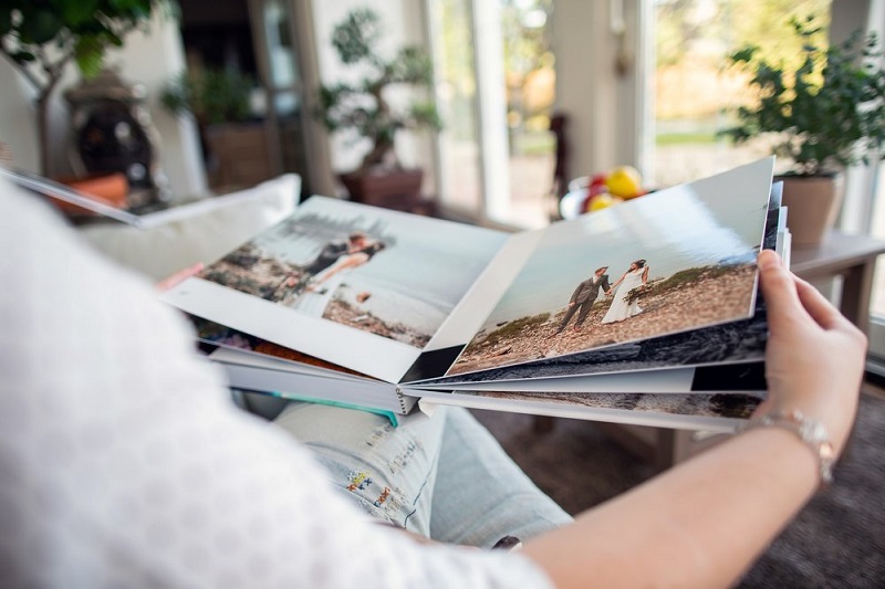 woman watching her photos on a personalised photobook
